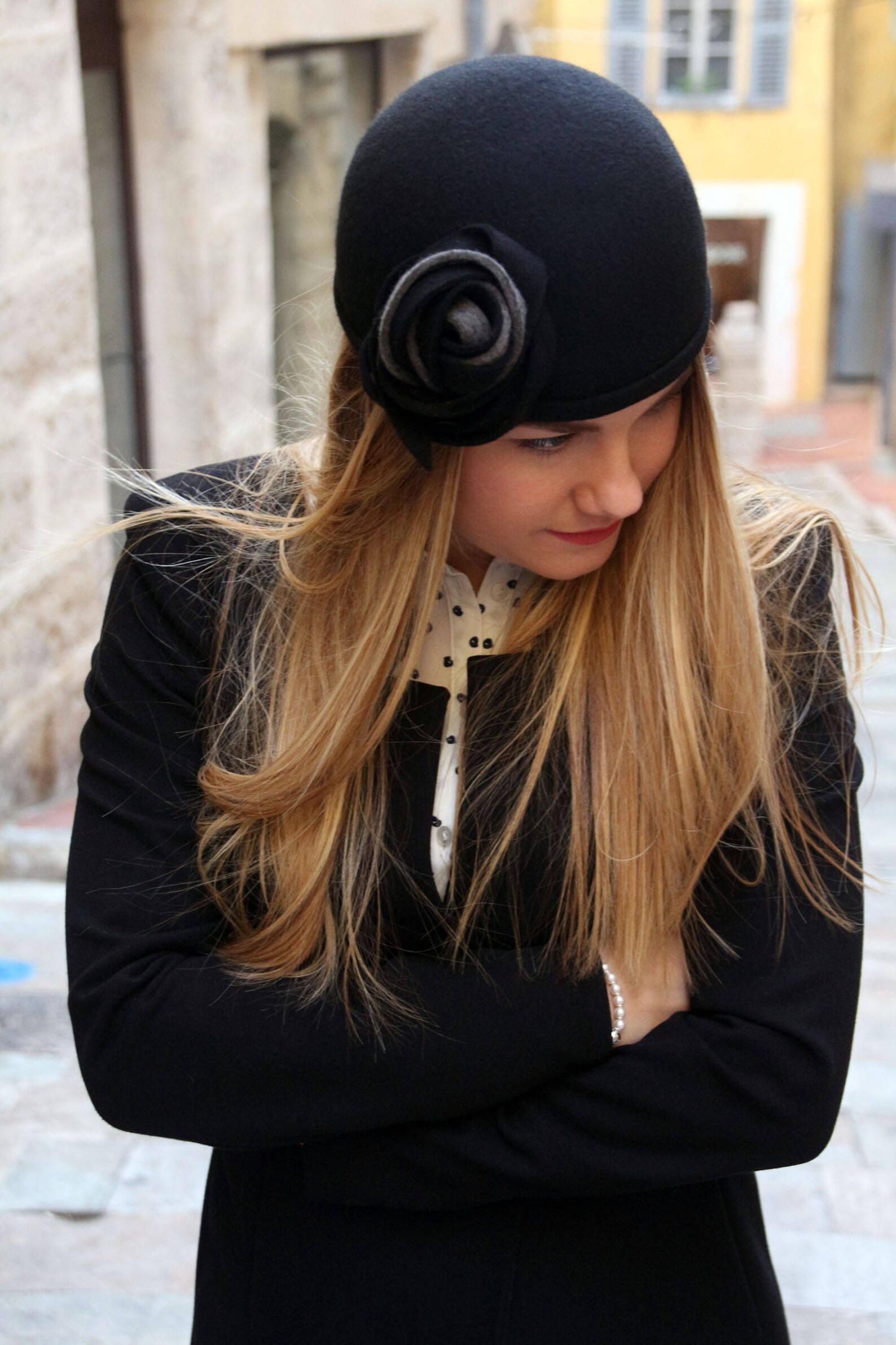 Classic black wool cloche hat with oversized flowers